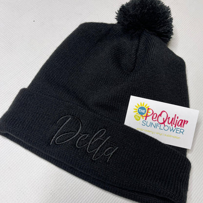 Delta pom beanie